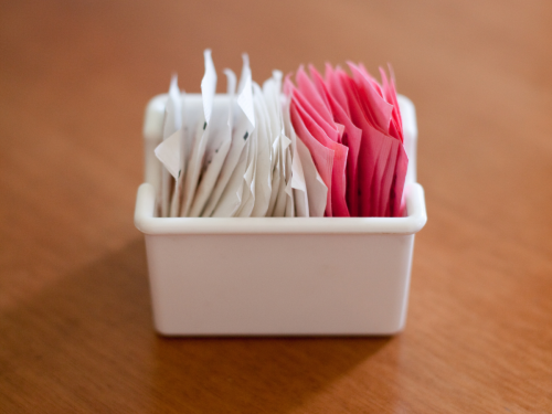 sugar packets in container