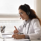 Medical Practicioner using a laptop